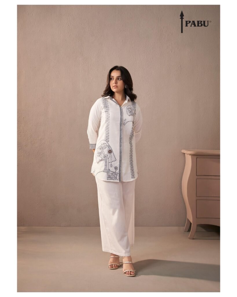 Ivory White Art-Inspired Shirt Kurta Set with Abstract Embroidery A striking blend of minimalism and artistic flair. Featuring unique abstract face and floral motifs. Perfect for gallery walks, brunches, or casual elegance.